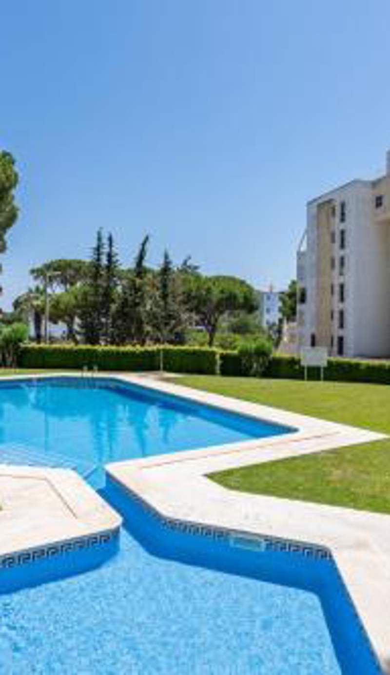 HostWise - Sunny Escape with a Pool & Balcony
